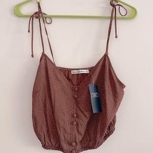 Crop tank with tie straps in brown polka dot size small